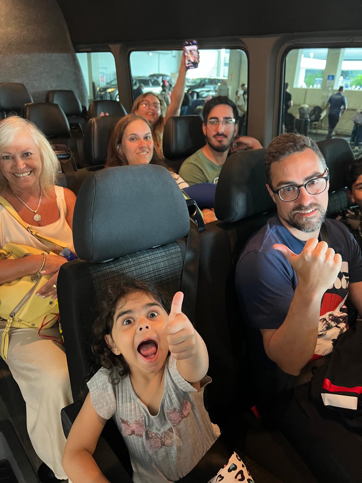 Happy family riding with Miami Airport Shuttle and Limo